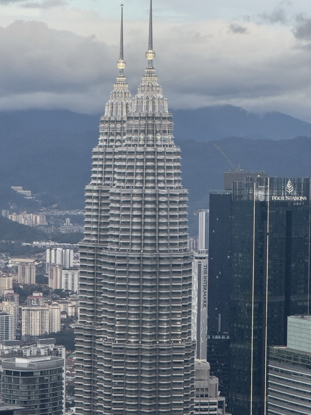 Aerial view of the Petronas Twin Towers over Kuala Lumpur
